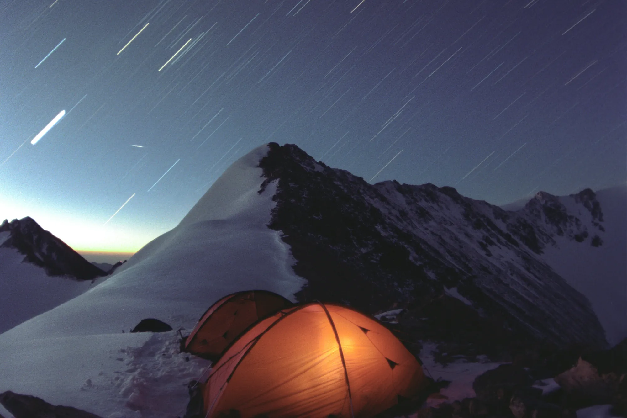 Tents under star trails